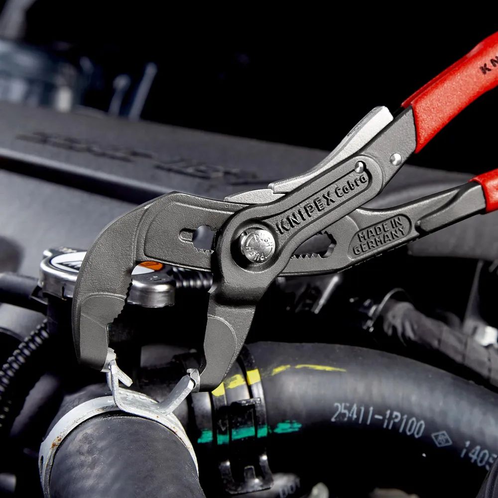 KNIPEX Federbandschellenzange mit Feststeller mit rutschhemmendem Kunststoff überzogen grau atramentiert 250 mm