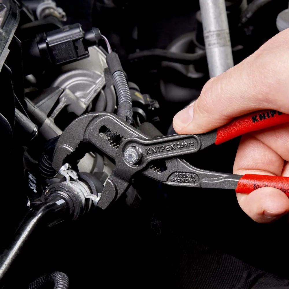 KNIPEX Federbandschellenzange mit rutschhemmendem Kunststoff überzogen grau atramentiert 180 mm