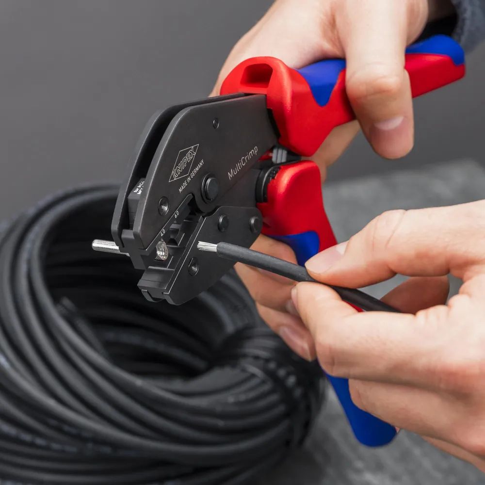 KNIPEX MultiCrimp® Crimpzange mit Wechselmagazin mit Mehrkomponenten-Hüllen brüniert 250 mm