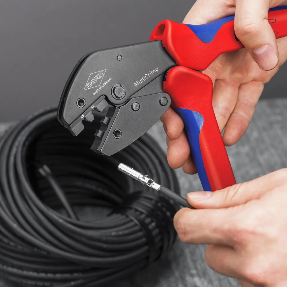 KNIPEX MultiCrimp® Crimpzange mit Wechselmagazin mit Mehrkomponenten-Hüllen brüniert 250 mm
